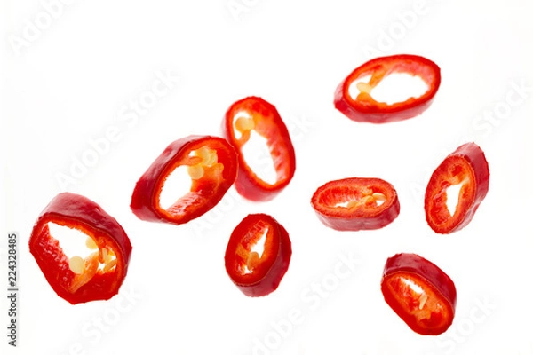 Fototapeta Pieces of red chili pepper close-up, planted up