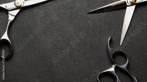 Obraz scissors on black background