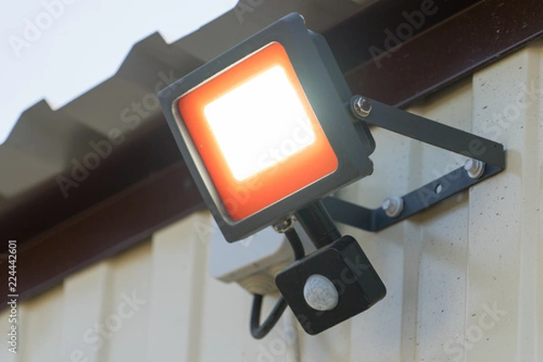 Fototapeta Led spotlight with motion sensor. Place for your text.