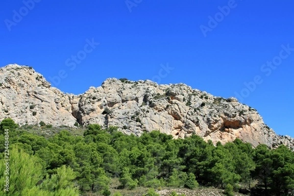 Fototapeta sandstone escarpment with cave