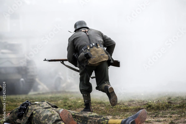 Fototapeta Historical reenactment of soldiers during the Second World War, view from the back