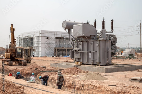 Fototapeta Power transformers are being installed for use in high voltage substations.