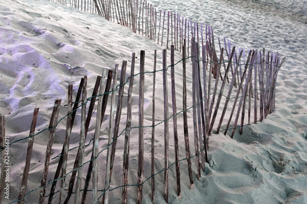 Obraz Fence on a sandy beach