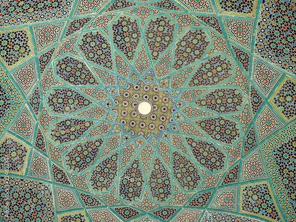 Fototapeta Detail of blue geometric patterns on the ceiling of a pavilion at the Tomb of Hafez, a memorial to a famous Iranian poet, in the city of Shiraz in southern Iran