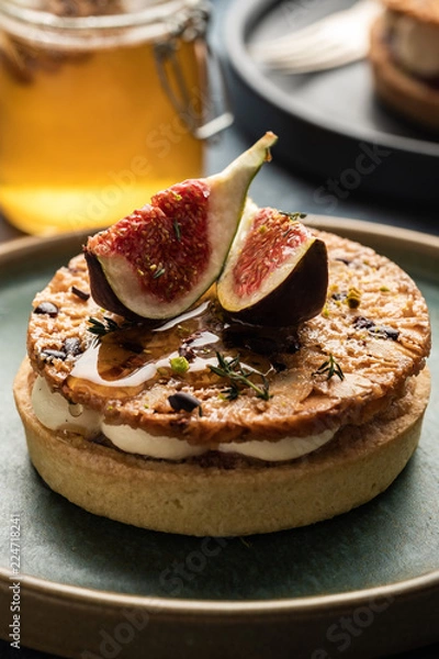 Fototapeta Tarte on sand base with fresh figs, almonds and crispy waffle with almonds and cocoa powder. Fresh Homemade Fruit Tart with berries