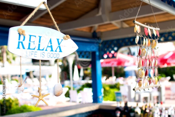 Obraz bar on the beach decorated with seashells and inscription "relax" in a hotel on the territory of Albania, the Adriatic coast