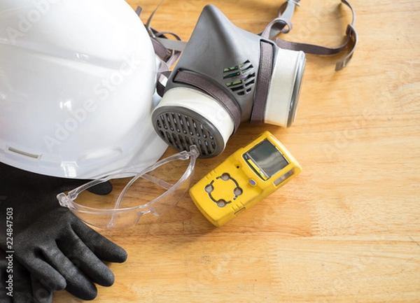 Obraz Standard personal protective equipment on wooden table. top view, concept safety 