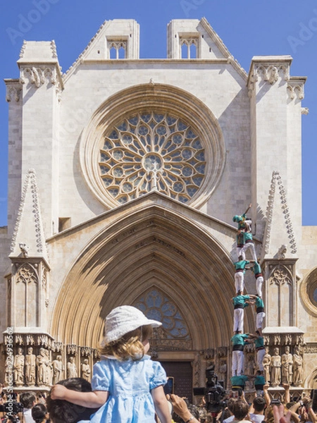 Fototapeta Human castles in front of a cathedral