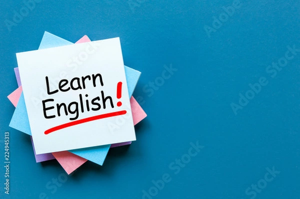 Obraz Learn english - note at blue background with empty space for text