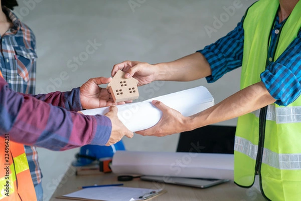 Fototapeta Real estate agent success job to tranfer finished building project to home buyer