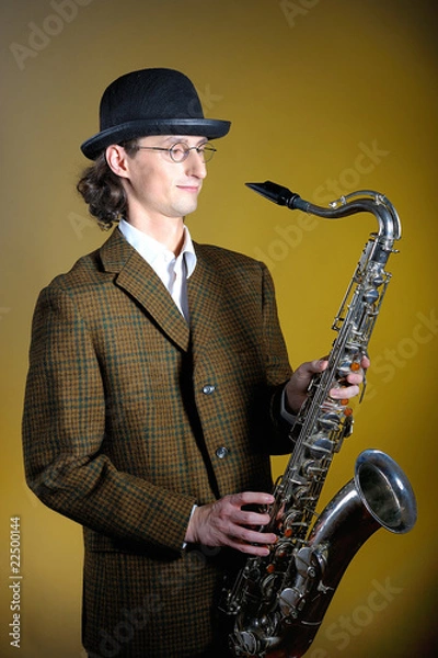 Obraz portrait of young retro man playing saxophone