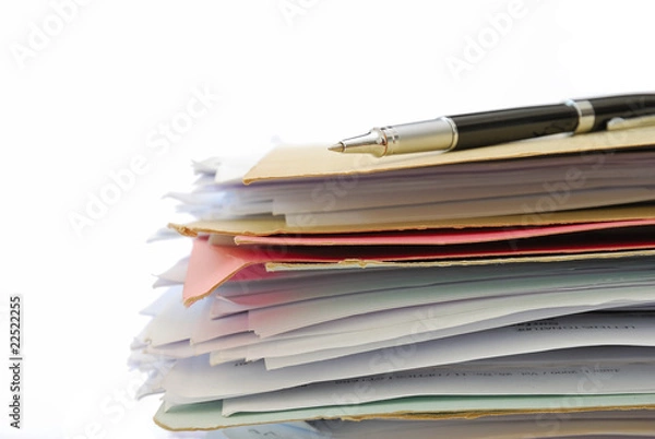 Fototapeta Pen on stack of files full of documents