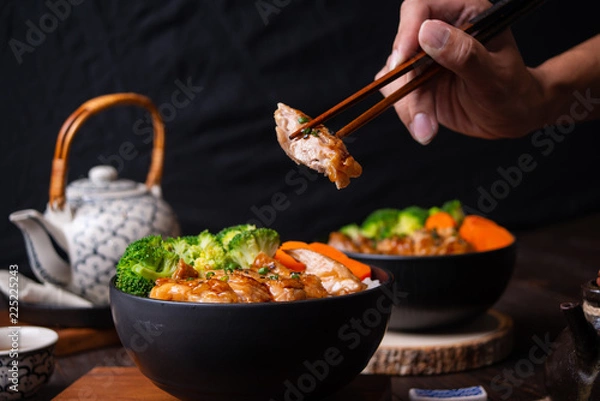 Fototapeta Japanese food, fried pork on rice, topped with sauce, Japanese style