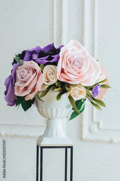 Obraz Wedding decor concept. Beautiful flowers made in bouquet in vase on stand isolated over white background. Floral concept. Festive event