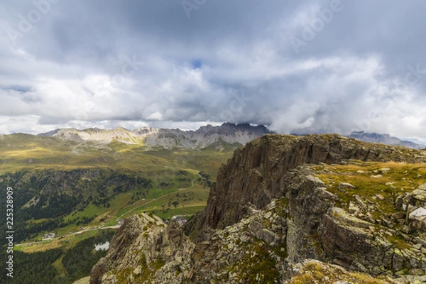 Fototapeta Mountain scenery in the Transylvanian Alps in summer, with mist and rain clouds