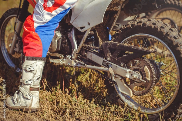 Obraz woman on enduro motocross in motion, desire for victory, dynamics of speed