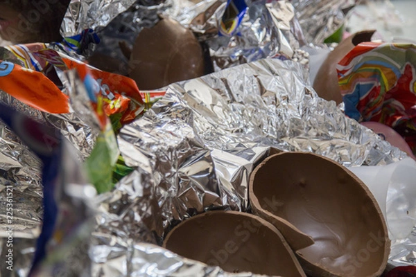 Fototapeta image of open chocolate easter eggs on the table