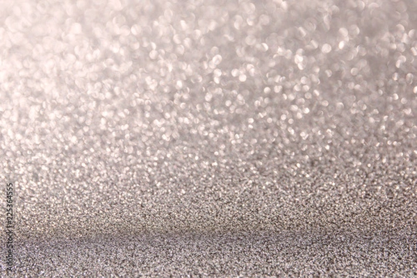Fototapeta The Glittering glitter background with a bokeh.