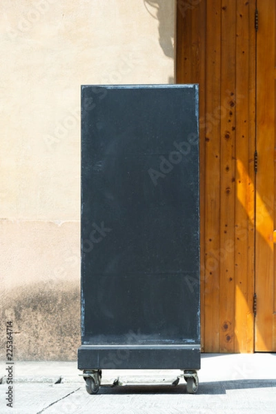 Fototapeta Large blank billboard on a street wall, banners with room to add your own text