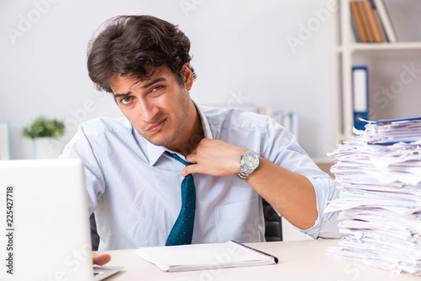 Fototapeta Overloaded busy employee with too much work and paperwork