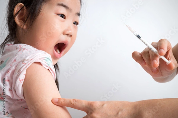 Obraz Distressed little girl getting an injection