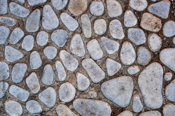 Fototapeta Old round stone blocks is on top