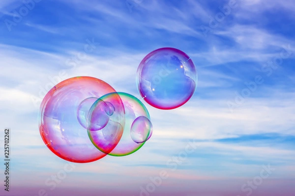 Obraz Colored soap bubbles against the sky. Sky background and bubbles.