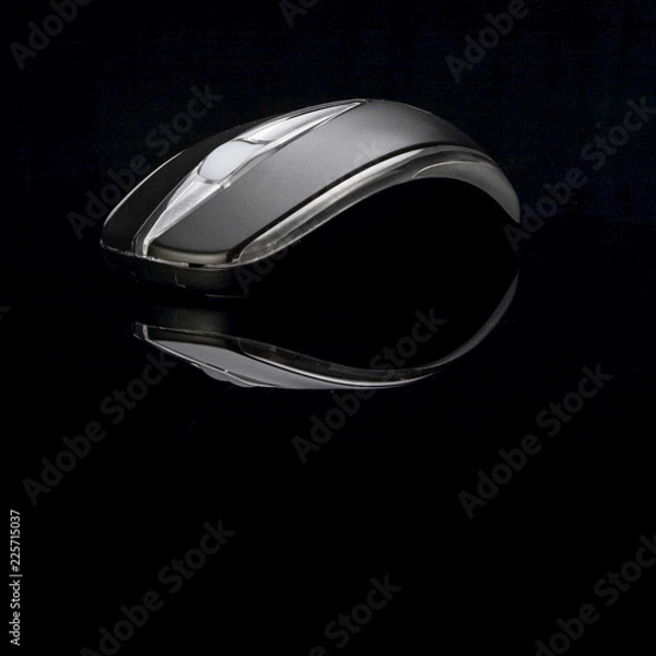 Fototapeta Black computer mouse on black background