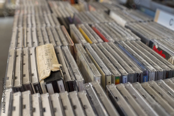 Fototapeta cd on the shelf in a public library, bound, to be used as a background