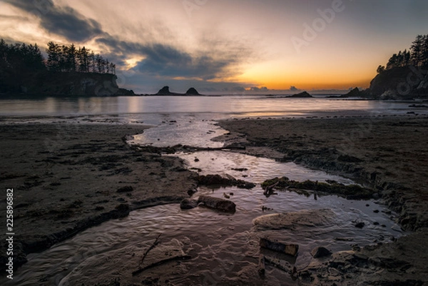 Fototapeta Sunset Beach State Park sunset with stream, beach and colorful sky.