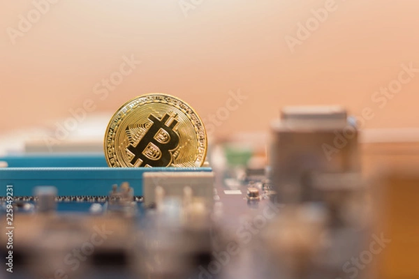 Obraz Bitcoin coin in  video card pci-express slot , mining virtual cripto money