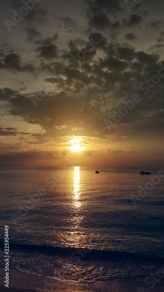 Fototapeta Sunset over the beach in Caribbean