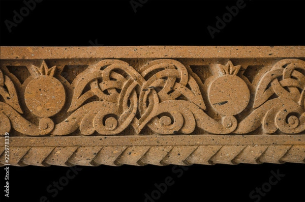 Obraz Relief border with a pattern of curved leaves and pomegranates,on carved stone letters in the Church of St. Mesrop Mashtots in  Oshakan
