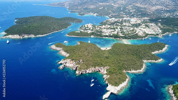 Fototapeta Aerial drone bird's eye view photo of iconic paradise sandy beaches with turquoise sea in complex islands of Agios Nikolaos and Mourtos in Sivota area, Ionian sea, Epirus, Greece