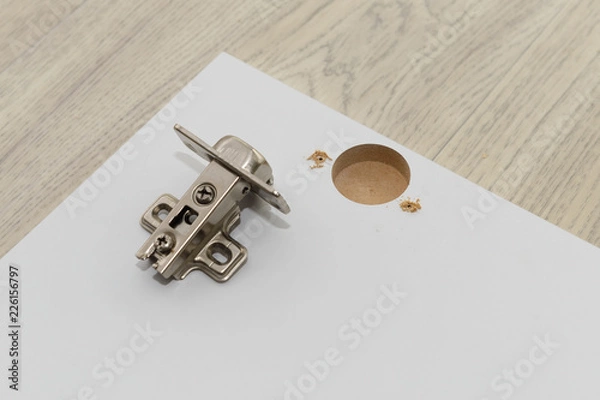 Fototapeta urniture hinge and facade made of MDF with a hole for the hinge