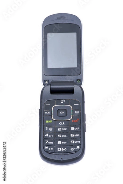 Obraz Old used flip cell phone isolated on white background