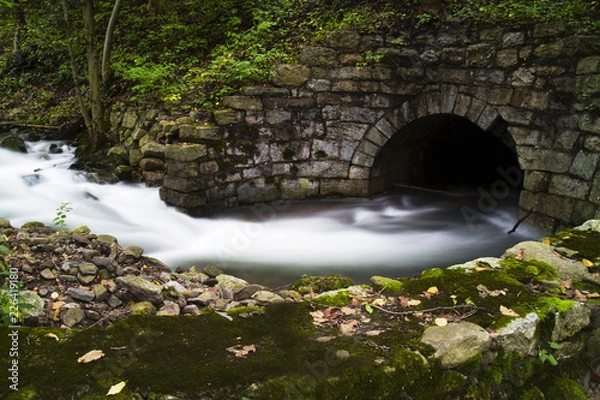 Obraz Stream Flowing Into Old Stone Tunnel 