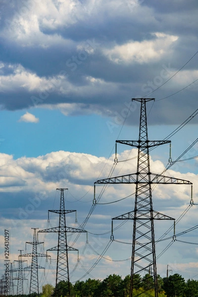 Fototapeta high-voltage power lines at sunset. electricity distribution station .