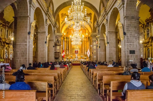 Fototapeta Cusco, Peru; January 22, 2017: Inside of La Merced Convent with chandeliers, pulpit and altar in Cusco, Peru