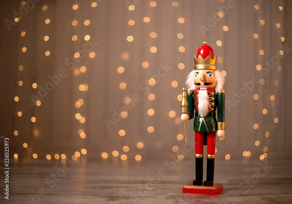 Fototapeta Toy nutcracker on a festive background