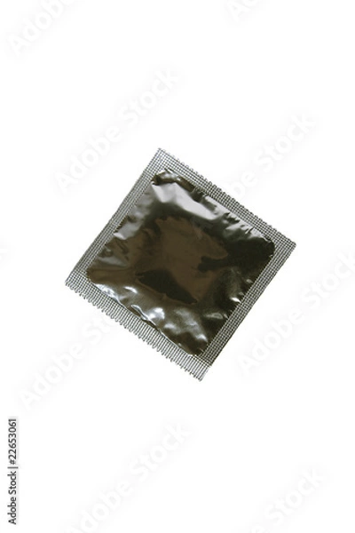 Fototapeta Photo of the packed condom on a white background