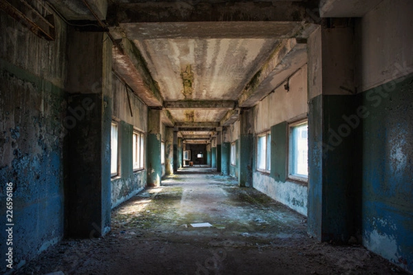 Fototapeta Creepy grunge tunnel or corridor in old ruined building. Way to freedom and hope concept