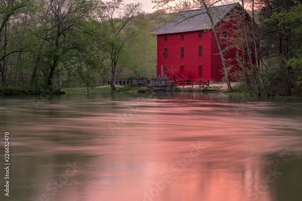 Obraz Red Mill Barn across the spring pond