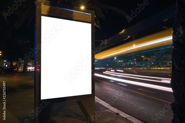 Fototapeta White advertisement lightbox at night. Commercial mock-up. Horizontal. Blank space for content in a city. 