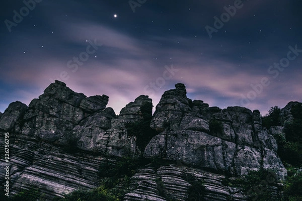 Fototapeta Torcal rocky mountains with the cloudy purple sky in the background