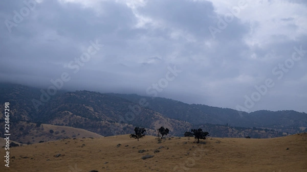 Fototapeta landscape with mountains and clouds