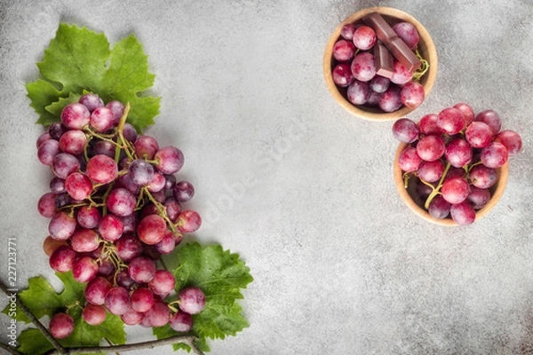 Fototapeta Grapes on stone background. Top view with space for your text