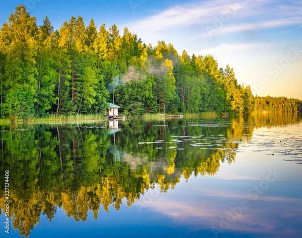 Obraz Tampere Finland lake reflections on water with little house on the water, beautiful sky with many colors and trees