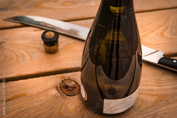 Fototapeta Sabrage is a technique for opening a champagne bottle with a saber