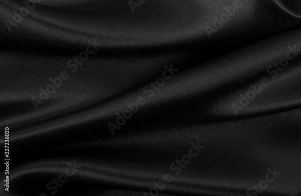 Fototapeta Smooth elegant black silk or satin texture as abstract background. Luxurious background design